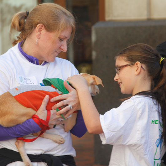 a kind family caring for a rescue dog