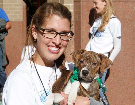 Woman holding rescued dog